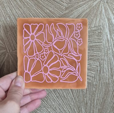 Tegeltje met tekst
Bloemenpatroon oranje